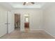 Neutral bedroom with carpet flooring, a ceiling fan, and access to the en-suite bathroom and hallway at 2819 Hillside Way, Decatur, GA 30034