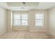 Neutral bedroom with carpet and natural light from the two windows at 2819 Hillside Way, Decatur, GA 30034