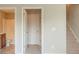 Hallway showing access to bathroom and staircase, with neutral color walls and flooring at 2819 Hillside Way, Decatur, GA 30034