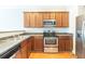 Traditional kitchen featuring stainless steel appliances, wooden cabinets, and laminate countertops at 2819 Hillside Way, Decatur, GA 30034