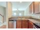 Kitchen featuring stainless steel dishwasher, sink, and wooden cabinets at 2819 Hillside Way, Decatur, GA 30034