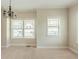Light-filled living room with neutral walls, carpet flooring, and large windows providing natural light at 2819 Hillside Way, Decatur, GA 30034