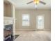 Cozy living room with a fireplace, window views, and a door to the outside at 2819 Hillside Way, Decatur, GA 30034