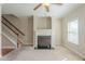 Cozy living room with a fireplace, window views, and staircase at 2819 Hillside Way, Decatur, GA 30034