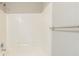 White tiled shower with seat and stainless steel fixtures at 2819 Hillside Way, Decatur, GA 30034