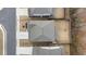 Birds-eye view showcases the roof and backyard in context to neighboring properties at 514 Cunninghame Ct, Peachtree City, GA 30269