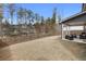 Spacious backyard featuring a covered patio with outdoor seating and a wood fence at 514 Cunninghame Ct, Peachtree City, GA 30269