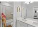 Bright bathroom with double sinks, a bathtub, and cheerful decor at 514 Cunninghame Ct, Peachtree City, GA 30269