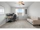 Bedroom offers a comfortable workspace with natural light and a cozy seating area at 514 Cunninghame Ct, Peachtree City, GA 30269