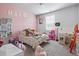 Colorful bedroom with playful decor and ample space for activities at 514 Cunninghame Ct, Peachtree City, GA 30269