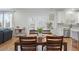 Open-concept dining area showcasing hardwood floors, modern décor, and plenty of natural light at 514 Cunninghame Ct, Peachtree City, GA 30269