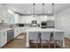 Spacious kitchen featuring a center island, modern appliances, pendant lighting, and ample cabinet space at 514 Cunninghame Ct, Peachtree City, GA 30269