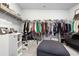 Well-organized walk-in closet with shelving and rods for ample storage at 514 Cunninghame Ct, Peachtree City, GA 30269
