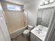 Well-lit bathroom with a tub-shower combo and neutral color palette at 5281 Brookshire Ct, Douglasville, GA 30135
