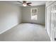 Bedroom featuring a ceiling fan, natural light and double door closet at 5281 Brookshire Ct, Douglasville, GA 30135