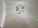Neutral bedroom featuring neutral carpet, and natural light at 5281 Brookshire Ct, Douglasville, GA 30135