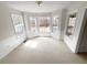 Sun-filled breakfast nook with large bay window and neutral carpeting at 5281 Brookshire Ct, Douglasville, GA 30135