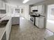 Bright kitchen features white cabinets, stainless steel oven and a sunny breakfast nook at 5281 Brookshire Ct, Douglasville, GA 30135