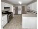 Bright, spacious kitchen with stainless steel appliances and ample countertop space at 5281 Brookshire Ct, Douglasville, GA 30135