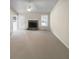 Spacious living room with vaulted ceiling, fireplace, neutral tones, and ample natural light at 5281 Brookshire Ct, Douglasville, GA 30135