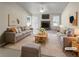 Bright, staged living room with a stone fireplace and comfortable seating area at 5281 Brookshire Ct, Douglasville, GA 30135