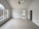 Spacious main bedroom with vaulted ceiling, large window, and neutral carpet at 5281 Brookshire Ct, Douglasville, GA 30135