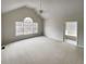 Airy main bedroom with vaulted ceilings, large windows, and ensuite bathroom access at 5281 Brookshire Ct, Douglasville, GA 30135