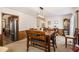 The dining room features a wooden table with seating for six and stylish light fixture at 6325 S Summers S Cir, Douglasville, GA 30135