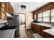 Traditional kitchen with wood cabinets, laminate countertops, and modern appliances at 6325 S Summers S Cir, Douglasville, GA 30135
