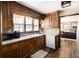 Classic kitchen with wooden cabinetry, modern appliances, and hardwood flooring at 6325 S Summers S Cir, Douglasville, GA 30135