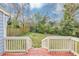Image of a well-maintained backyard with a green lawn surrounded by trees at 16 Wadley Nw St, Atlanta, GA 30314