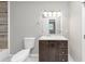 Bathroom features a dark brown vanity, marble floors, and a well lit mirror, providing a relaxing space at 16 Wadley Nw St, Atlanta, GA 30314