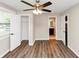 Cozy bedroom boasts durable wood floors, a ceiling fan, and ensuite bathroom access for ultimate convenience at 16 Wadley Nw St, Atlanta, GA 30314