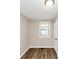 Bedroom with wood floor and a window letting in natural light at 16 Wadley Nw St, Atlanta, GA 30314