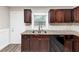Features modern appliances, granite countertops, and dark wood cabinets, seamlessly blending style and functionality at 16 Wadley Nw St, Atlanta, GA 30314