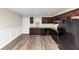 Renovated kitchen features dark wood cabinets, granite countertops, and modern appliances at 16 Wadley Nw St, Atlanta, GA 30314