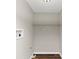 A practical laundry room with connections and a wire rack for organization at 16 Wadley Nw St, Atlanta, GA 30314