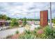 View of Tee White building in vibrant West End, complete with lush greenery and clear way-finding signage at 1824 Evans Sw Dr, Atlanta, GA 30310