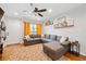 Cozy living room with a comfortable sectional sofa, decorative shelves, and a stylish rug, creating a welcoming atmosphere at 1824 Evans Sw Dr, Atlanta, GA 30310