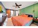 Spacious main bedroom featuring stylish decor, ample natural light, and a barn door leading to the ensuite bathroom at 1824 Evans Sw Dr, Atlanta, GA 30310