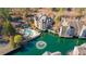 Stunning aerial view of a lakeside community with a pool, fountains, and well-manicured grounds at 504 Mill Pond Ct, Smyrna, GA 30082