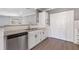 Modern kitchen with granite countertops, stainless steel appliances, and white cabinetry for ample storage at 504 Mill Pond Ct, Smyrna, GA 30082