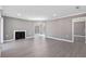 Bright and spacious living room with hardwood floors, fireplace, and view to outdoor space at 504 Mill Pond Ct, Smyrna, GA 30082