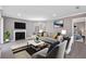 Modern living room featuring stylish furniture, a fireplace, and a glimpse into the bedroom at 504 Mill Pond Ct, Smyrna, GA 30082