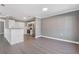Open concept living room area with stainless steel appliances, and white cabinets at 504 Mill Pond Ct, Smyrna, GA 30082