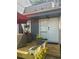 Exterior of the home highlighting a back deck with outdoor seating and potted flowers at 1044 Mariners Ct, Stone Mountain, GA 30083