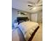 Bedroom featuring ceiling fan, carpeted floors, neutral colors, and closet at 1044 Mariners Ct, Stone Mountain, GA 30083
