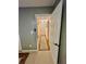 Hallway with neutral paint and light-colored carpet and decor at 1044 Mariners Ct, Stone Mountain, GA 30083