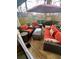 Inviting patio with wicker seating, a cozy umbrella, and a charming outdoor ambiance at 1044 Mariners Ct, Stone Mountain, GA 30083