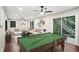 Finished basement features a pool table, large seating area, and access to an outdoor deck at 1920 Rocky Mill Ln, Lawrenceville, GA 30044